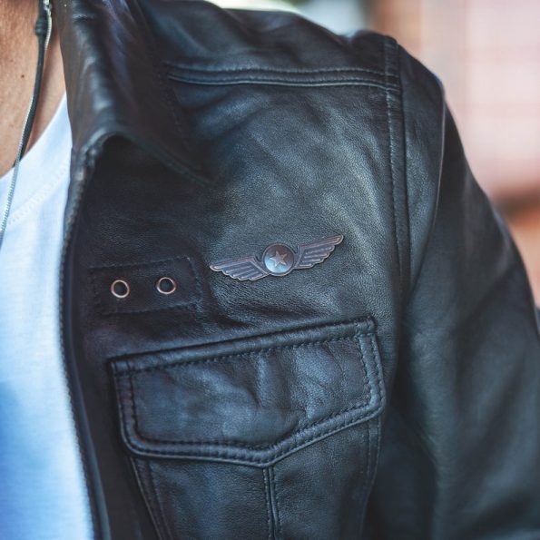 Men's vintage black leather flight jacket with fur collar in USA