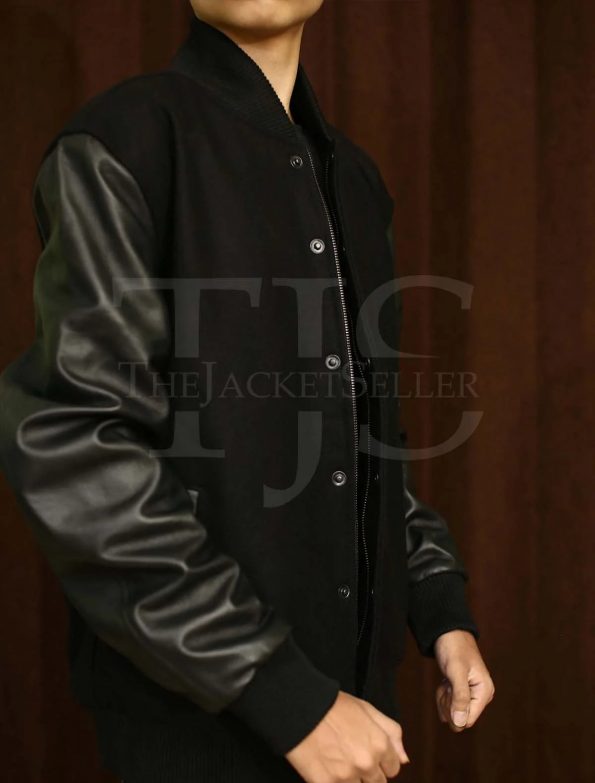 Stylish varsity jacket with black leather sleeves and classic design