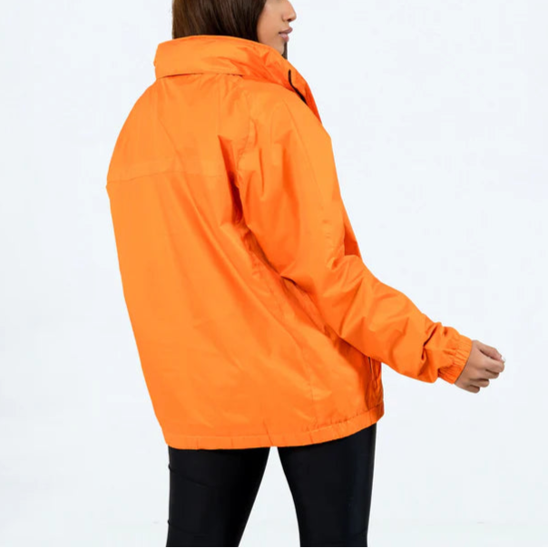 Person wearing an orange jacket on a white background in USA